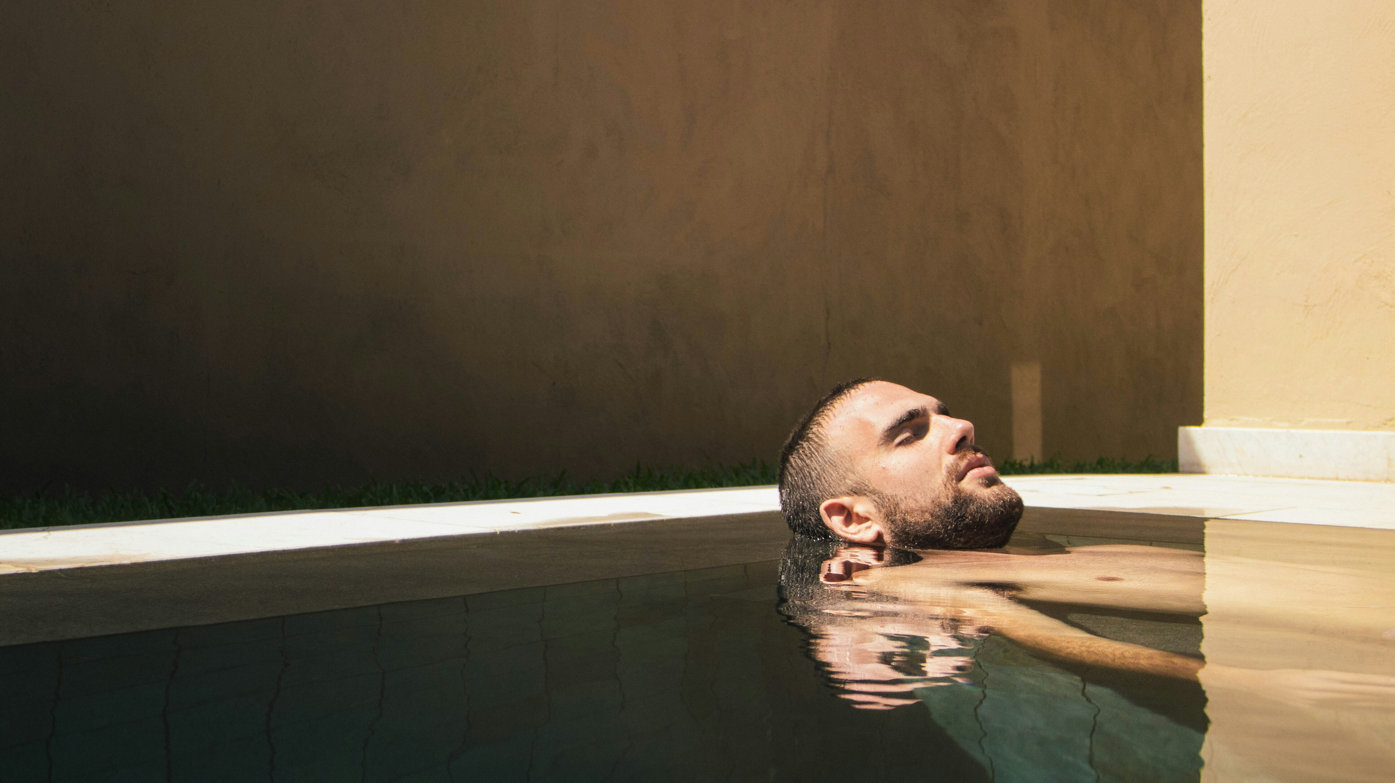 Man soaking in spa during personalised wellness hotel experience